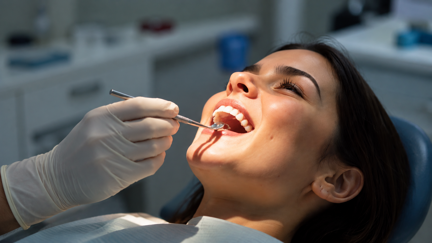 A smiling patient reclining in a dental chair during a gentle examination at Star Dental Practice